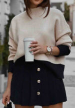 Γυναικείο πλεκτό σε μπεζ και μαύρο με ριμπ γιακά και contrast τελειώματα,